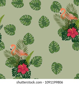 Tropical seamless pattern with leaves, red hibiscus flowers and pink flamingos. Background with a tropical bouquet. Flamingo. Pattern with tropical birds.