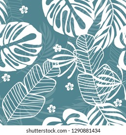 Tropical seamless pattern with leaves. White tropical leaves on blue background. 