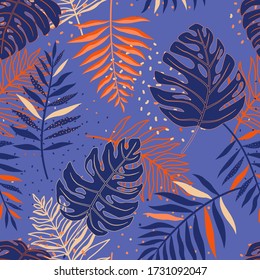 Tropical seamless pattern with monstera and palm leaves.
