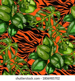 Tropical seamless pattern on animalistic texture. Jungle exotic summer print. Summer tropical leaf. Tropical flower fashion pattern. Floral tropic illustration. Vector seamless pattern.