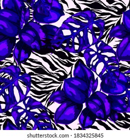 Tropical seamless pattern on animalistic texture. Jungle exotic summer print. Summer tropical leaf. Tropical flower fashion pattern. Floral tropic illustration. Vector seamless pattern.