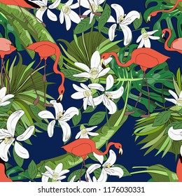 Tropical seamless pattern, orchids, monstera leaves, fan palm leaves and flamingoes on blue background. Hand drawn illustration.