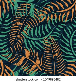 Tropical seamless pattern with palm leaves. Summer floral pattern with green and orange palm foliage on dark background. Cool seamless pattern for textile industry. Vector