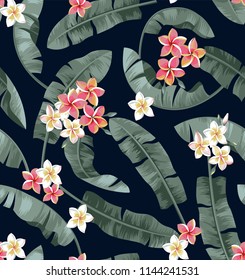 Tropical seamless pattern with palm leaves and exotic flowers. Vector illustration.