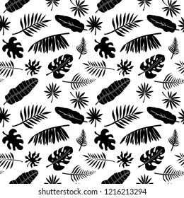 Tropical seamless pattern. Palm leaves, branches. Natural background texture. Summer print. Fabric design in black and white 