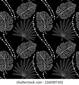 Tropical seamless pattern. Palm leaves silhouette, black and white. 