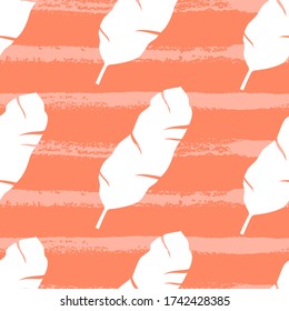 Tropical seamless pattern with palm leaves on orange background. Vector illustration of summer. Monochrome exotic wallpaper. For web design, banners, scrapbooking, printing on fabric, wrapping paper.