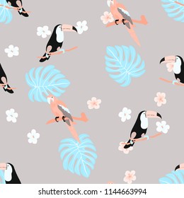 Tropical seamless pattern with a parrot, toucan and tropical flowers and leaves.