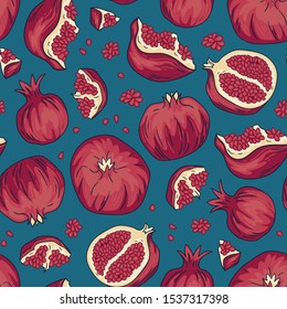 Tropical seamless pattern with pomegranate fruit while and slices with seeds on the blue background. Armenian fruit collection. Vector bright print design. 