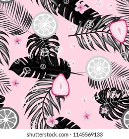 Tropical seamless pattern with strawberries, lemon, lime and tropical leaves. Bright fruit pattern with tropics. Background with fruits.