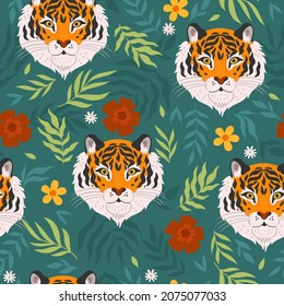 Tropical seamless pattern with tigers and leaves. Vector graphics.