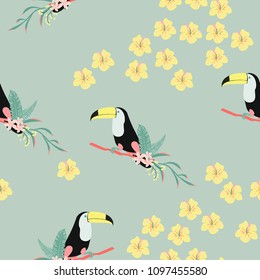 Tropical seamless pattern with toucan, flowers and leaves. Beautiful background with tropical leaves and flowers. Birds of the jungle. For covers, paper, wallpaper and fabric.