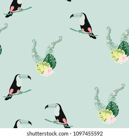Tropical seamless pattern with toucan, flowers and leaves. Beautiful background with tropical leaves and flowers. Birds of the jungle. For covers, paper, wallpaper and fabric.