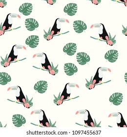Tropical seamless pattern with toucan, flowers and leaves. Beautiful background with tropical leaves and flowers. Birds of the jungle. For covers, paper, wallpaper and fabric.