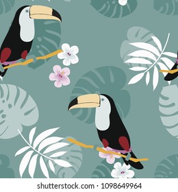 Tropical seamless pattern with toucan, flowers and leaves. A tropical forest with birds. Stylish tropical background with toucan.