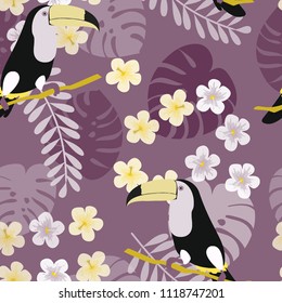 Tropical seamless pattern with toucan, flowers and leaves. A tropical forest with birds. Stylish tropical background with toucan.