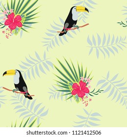 Tropical seamless pattern with toucan, flowers and leaves. Beautiful background with tropical leaves and flowers. Birds of the jungle. For covers, paper, wallpaper and fabric.