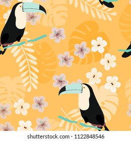 Tropical seamless pattern with toucan, flowers and leaves. Beautiful background with tropical leaves and flowers. Birds of the jungle. For covers, paper, wallpaper and fabric.