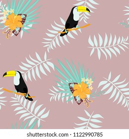 Tropical seamless pattern with toucan, flowers and leaves. A tropical forest with birds. Stylish tropical background with toucan.