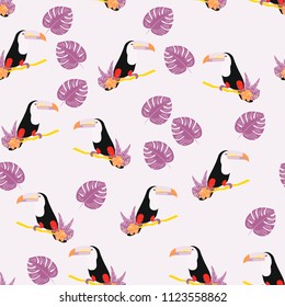 Tropical seamless pattern with toucan, flowers and leaves. Beautiful background with tropical leaves and flowers. Birds of the jungle. For covers, paper, wallpaper and fabric.