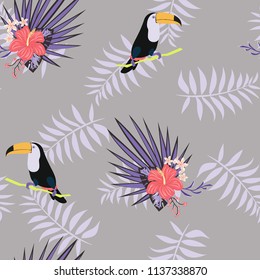Tropical seamless pattern with toucan, flowers and leaves. Beautiful background with tropical leaves and flowers. Birds of the jungle. For covers, paper, wallpaper and fabric.