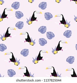 Tropical seamless pattern with toucan, flowers and leaves. A tropical forest with birds. Stylish tropical background with toucan.