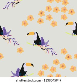 Tropical seamless pattern with toucan, flowers and leaves. Beautiful background with tropical leaves and flowers. Birds of the jungle. For covers, paper, wallpaper and fabric.