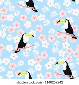Tropical seamless pattern with toucan, flowers and leaves. A tropical forest with birds. Stylish tropical background with toucan.