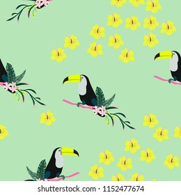 Tropical seamless pattern with toucan, flowers and leaves. A tropical forest with birds. Stylish tropical background with toucan.