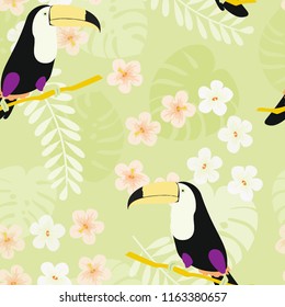 Tropical seamless pattern with toucan, flowers and leaves. A tropical forest with birds. Stylish tropical background with toucan.