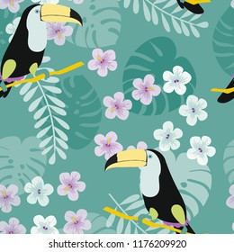 Tropical seamless pattern with toucan, flowers and leaves. A tropical forest with birds. Stylish tropical background with toucan.