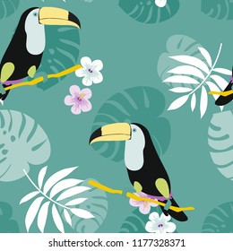 Tropical seamless pattern with toucan, flowers and leaves. A tropical forest with birds. Stylish tropical background with toucan.