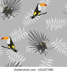 Tropical seamless pattern with toucan, flowers and leaves. Beautiful background with tropical leaves and flowers. Birds of the jungle. For covers, paper, wallpaper and fabric.