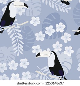 Tropical seamless pattern with toucan, flowers and leaves. A tropical forest with birds. Stylish tropical background with toucan.