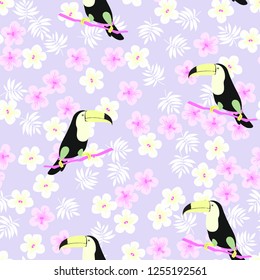 Tropical seamless pattern with toucan, flowers and leaves. A tropical forest with birds. Stylish tropical background with toucan.