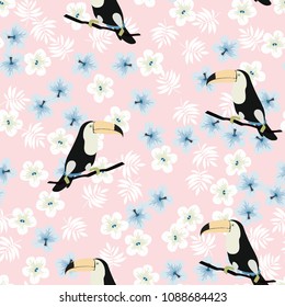 Tropical seamless pattern with toucan, leaves and flowers. Background with birds.