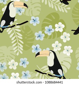 Tropical seamless pattern with toucan, leaves and flowers. Background with birds.