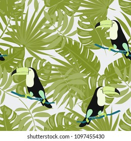 Tropical seamless pattern with toucan and leaves. Beautiful tropical leaves. Background with birds of the jungle for paper, covers, fabric.