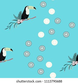 Tropical seamless pattern with toucan, tropical leaves and citrus. Lemon and lime. Summer background with tropical birds.