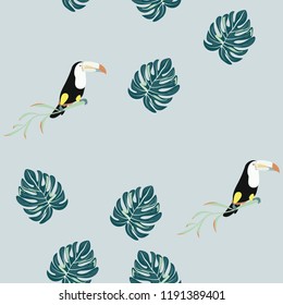 Tropical seamless pattern with toucan and leaves. Beautiful tropical leaves. Background with birds of the jungle for paper, covers, fabric.