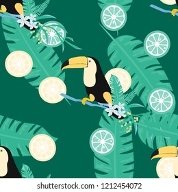 Tropical seamless pattern with toucan, tropical leaves and citrus. Lemon and lime. Summer background with tropical birds.