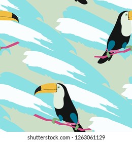 Tropical seamless pattern with toucan and leaves. Beautiful background with tropical leaves. Birds of the jungle. For covers, paper, wallpaper and fabric.