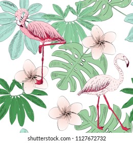 Tropical seamless vector pattern with flamingo and flowers.