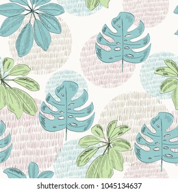 Tropical seamless vector pattern with green and blue leaves.
