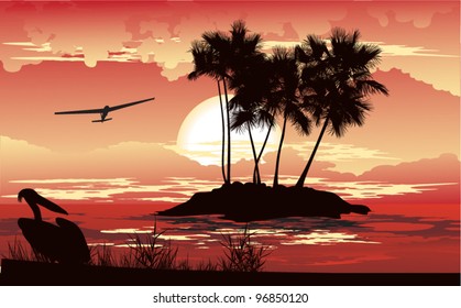 Tropical sunset on the distant island