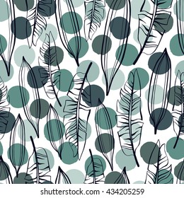 Tropical trendy seamless pattern with exotic palm leaves on a polka dot background.