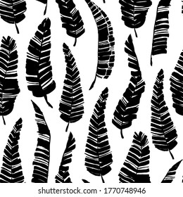 Tropical vector banana leaves seamless pattern. Black and white brush black paint banana leaves. Exotic abstract background. Ink illustration of tropical palm. Hand drawn ink texture with foliage. 