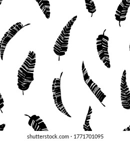 Tropical vector banana leaves seamless pattern. Black and white brush black paint banana leaves. Exotic abstract background. Ink illustration of tropical palm. Hand drawn ink texture with foliage. 