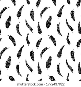 Tropical vector banana leaves seamless pattern. Black and white brush black paint banana leaves. Exotic abstract background. Ink illustration of tropical palm. Hand drawn ink texture with foliage. 
