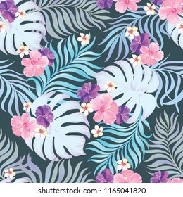 	
Tropical vector seamless background. Jungle pattern with flowers, monstera and palm leaves. Stock vector.